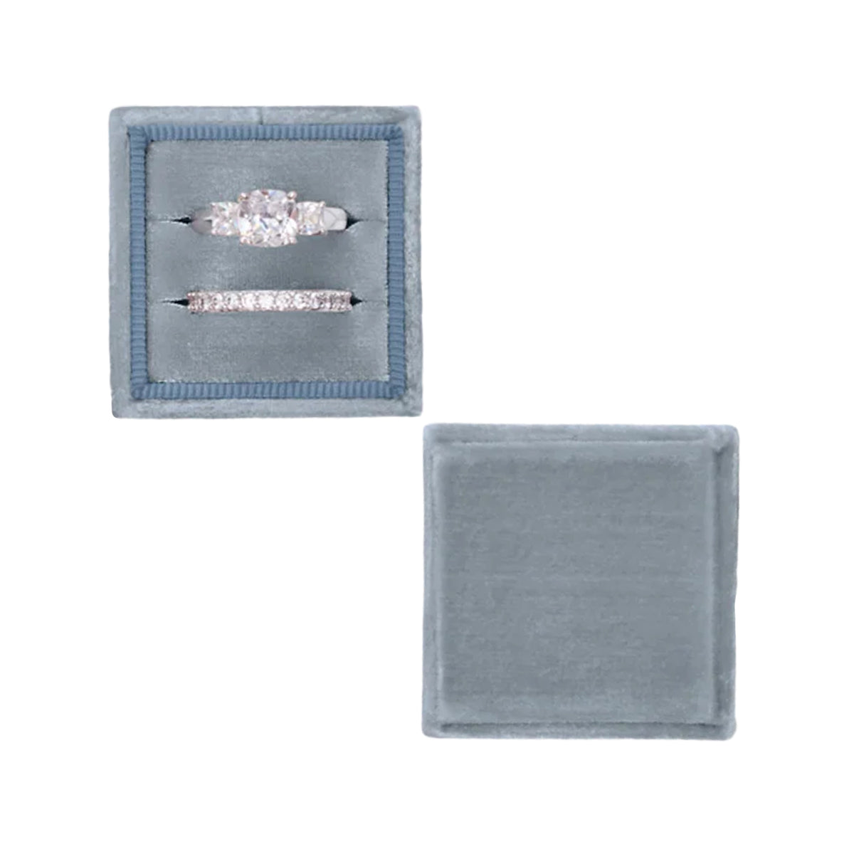 Top view of The Truman Classic Double ring box showing two ring slots in dusty blue velvet with lid beside it on white