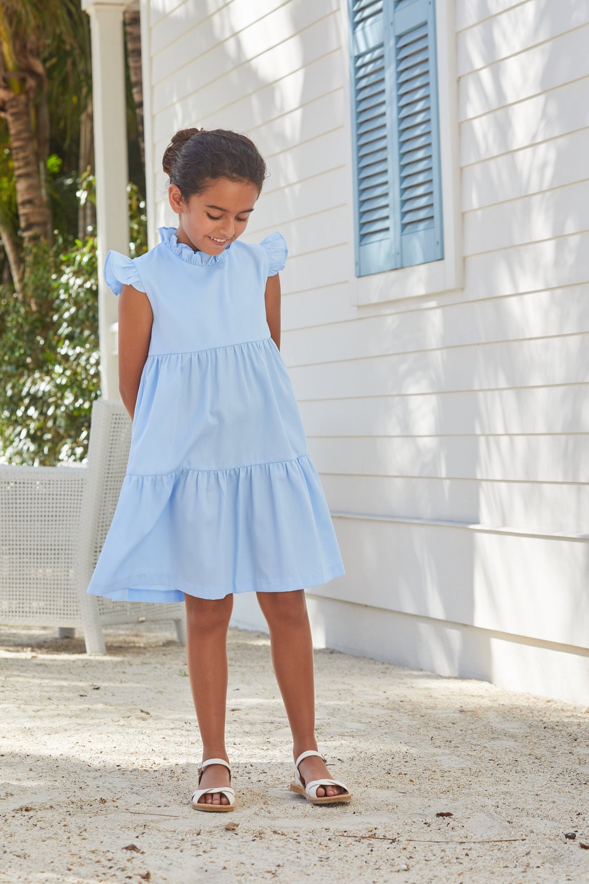 Little English traditional children‚Äôs clothing, girl's light blue tiered dress for Spring with ruffles at the collar and sleeves