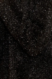 The turtleneck is made with shimmering yarn, oversized, long sleeves, and slightly cropped fit.