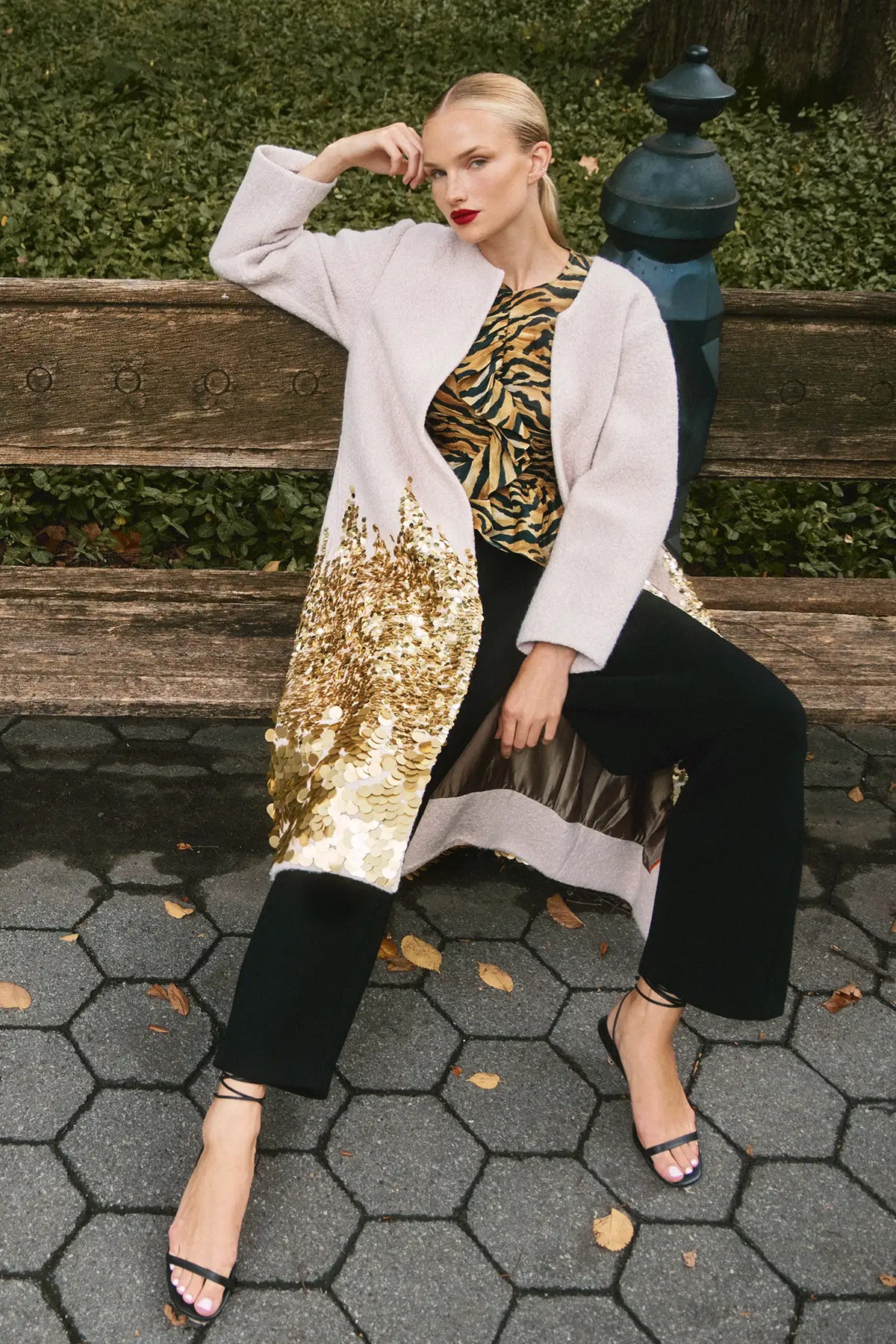 The Tinsley Coat is in our City Lights Gold Sequins Bouclé with a rounded neckline and long sleeves.