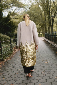 The Tinsley Coat is in our City Lights Gold Sequins Bouclé with a rounded neckline and long sleeves.