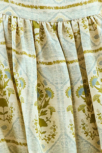 Close up of the Tipper Dress, square neck mini dress, in Green Trellis.