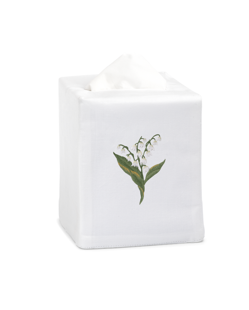 A white tissue cover with white lily of the valley flowers embroidered in the center.