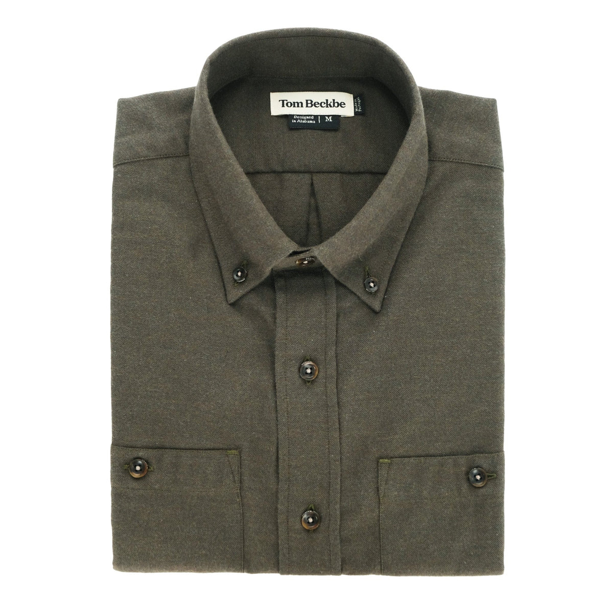 A folded olive green Dixon Brushed Cotton Twill Shirt by Tom Beckbe with button collar and cuffs, labeled inside.