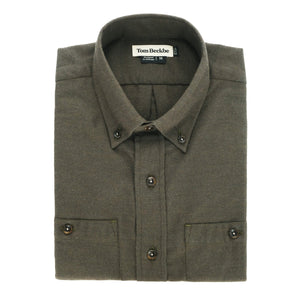 A folded olive green Dixon Brushed Cotton Twill Shirt by Tom Beckbe with button collar and cuffs, labeled inside.