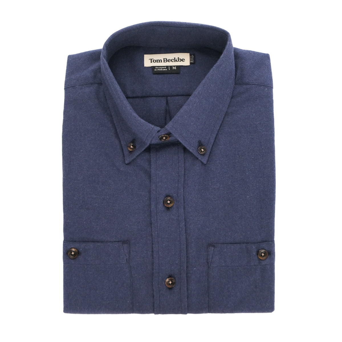 A folded Dixon Brushed Cotton Twill Shirt by Tom Beckbe, medium-weight, blue, long-sleeve, with buttoned cuffs.