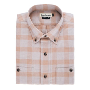 A folded Dixon Brushed Cotton Twill Shirt in beige and white plaid with front pockets and Tom Beckbe label visible.