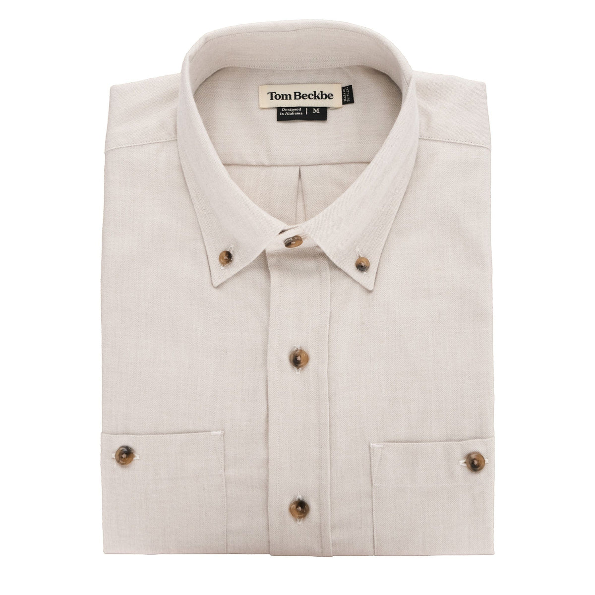 The Tom Beckbe Dixon Brushed Cotton Twill Shirt features a beige color, brown buttons, and a branded collar label.