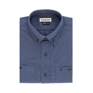 A folded blue Dixon Brushed Cotton Twill Shirt by Tom Beckbe with a collar and inner Tom Beckbe label.