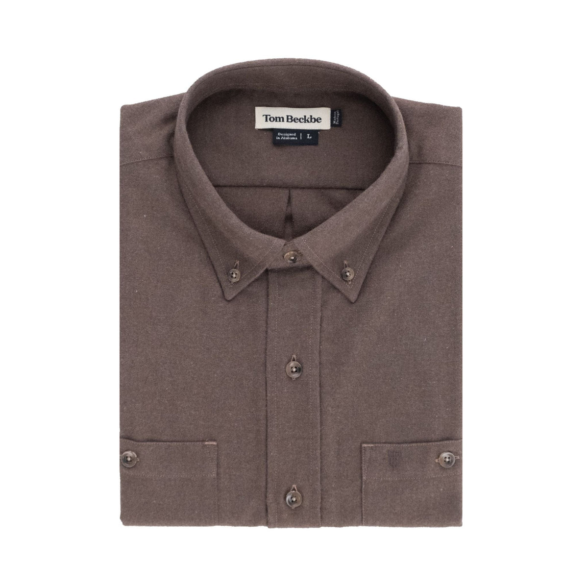 A folded brown Dixon Brushed Cotton Twill Shirt by Tom Beckbe, size large, with collar and front pockets.