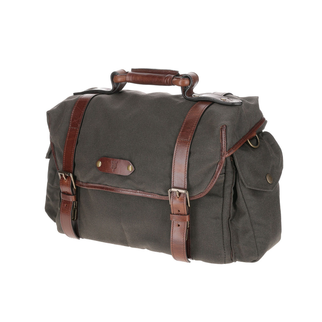Three-quarter view of the Bark Canvas Field Bag showcasing leather straps and top handle with white background