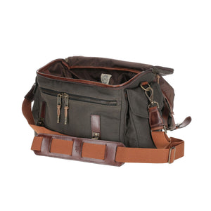 Front view of Bark Canvas Field Bag showcasing open compartments, front zippered pockets, and shoulder strap on white background