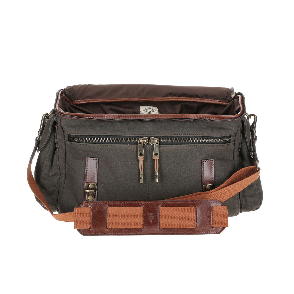 Front view of Canvas Field Bag showcasing open interior and front zippered pocket with a white background