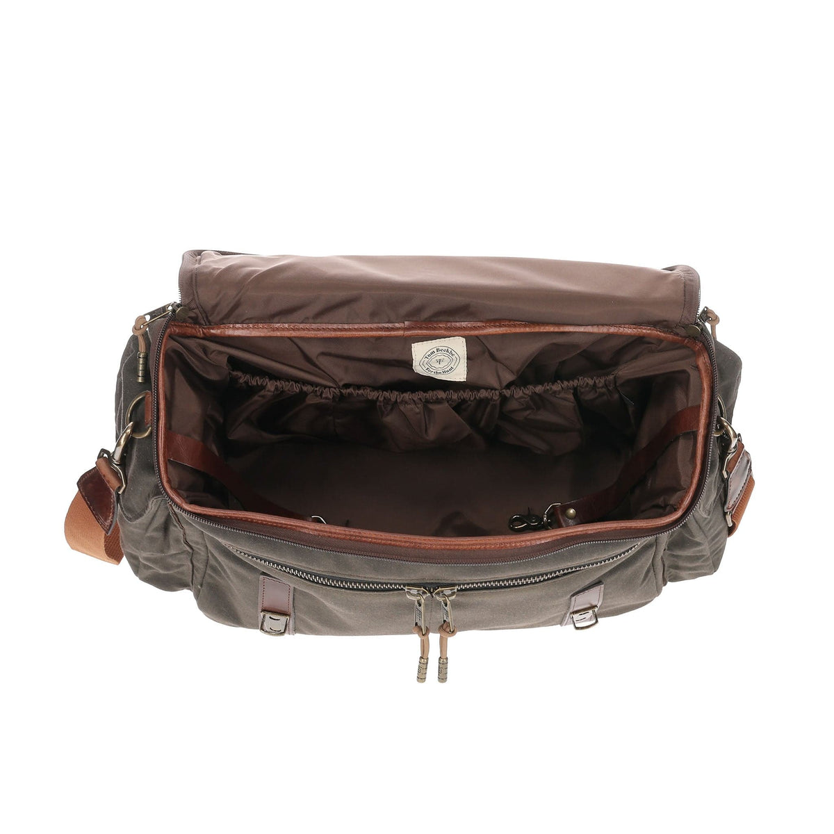 Top view of Canvas Field Bag showcasing open interior, zippered pocket, and interior clips with white background