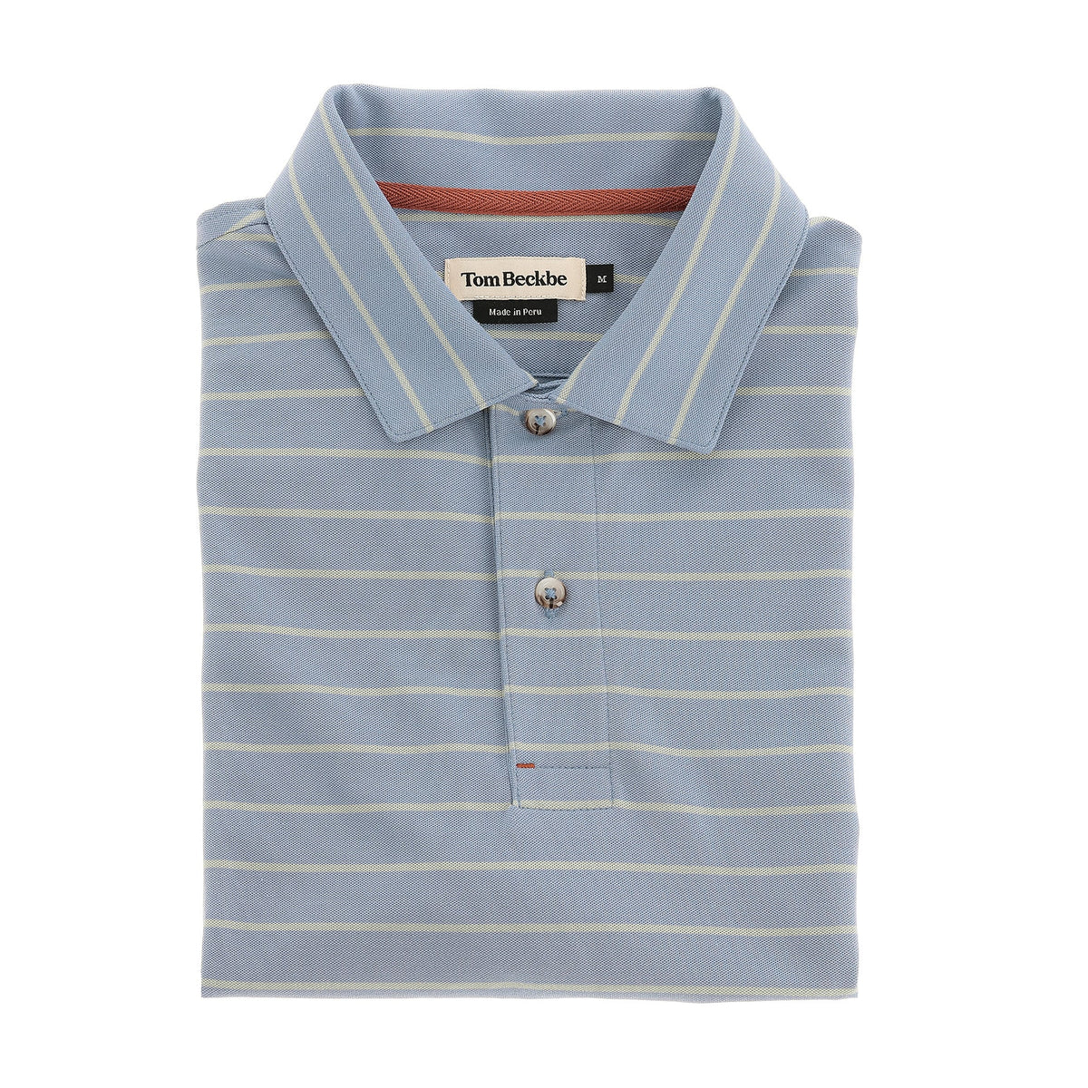 A folded light blue Hutton Performance Polo by Tom Beckbe with thin white stripes and a branded collar label.