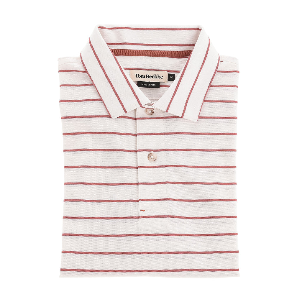 The Tom Beckbe Hutton Performance Polo is a white, moisture-wicking polo with red stripes and a buttoned collar.