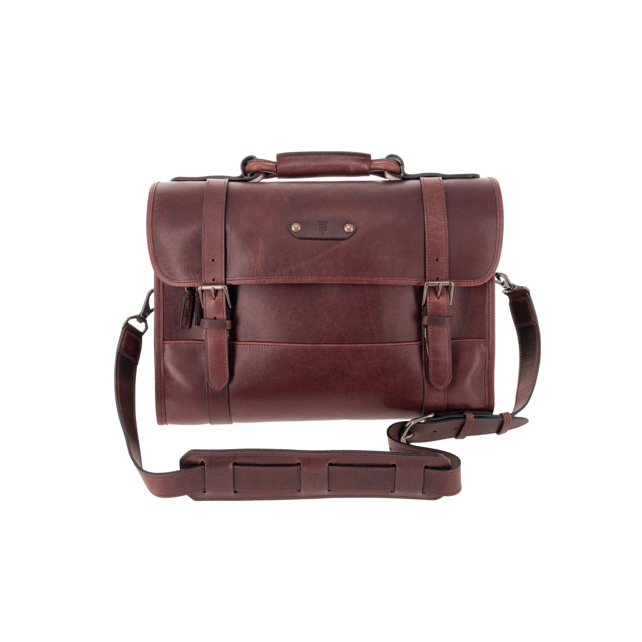 Tom Beckbe Leather Messenger Bag: brown full-grain leather, top handle, buckles, and padded laptop sleeve.