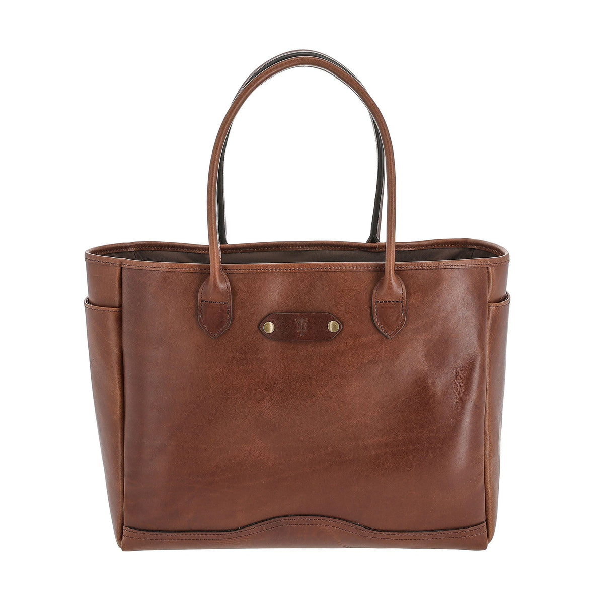 The Tom Beckbe Palmer Leather Tote is brown full-grain leather with 2 handles, a logo emblem, and side pockets.