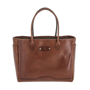 The Tom Beckbe Palmer Leather Tote is brown full-grain leather with 2 handles, a logo emblem, and side pockets.