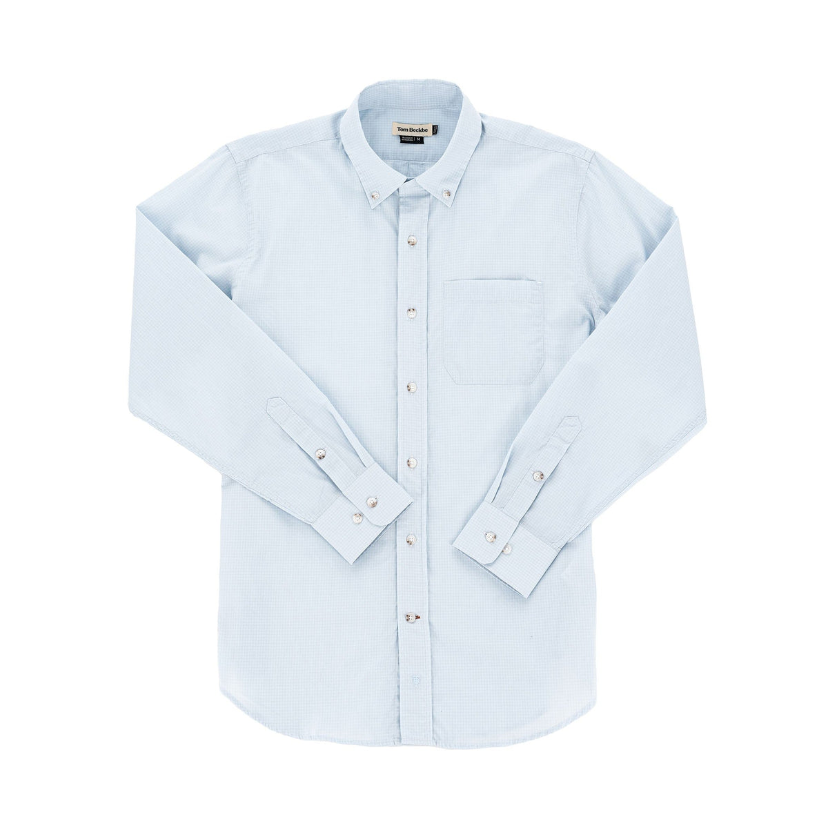Tom Beckbes Monroe Poplin Shirt, light blue cotton with a chest pocket and long sleeves, slightly wrinkled on white.