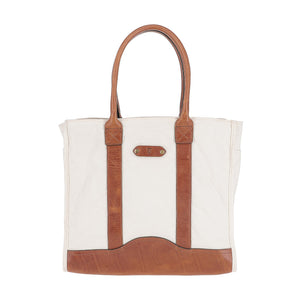 The Tom Beckbe Perdido Canvas Carryall Bag features brown leather handles, vertical trims, and a leather base.