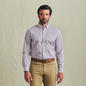 Man facing forward in a Tom Beckbe Powell Performance Shirt with UPF 30+, paired with khaki pants, on a light background.