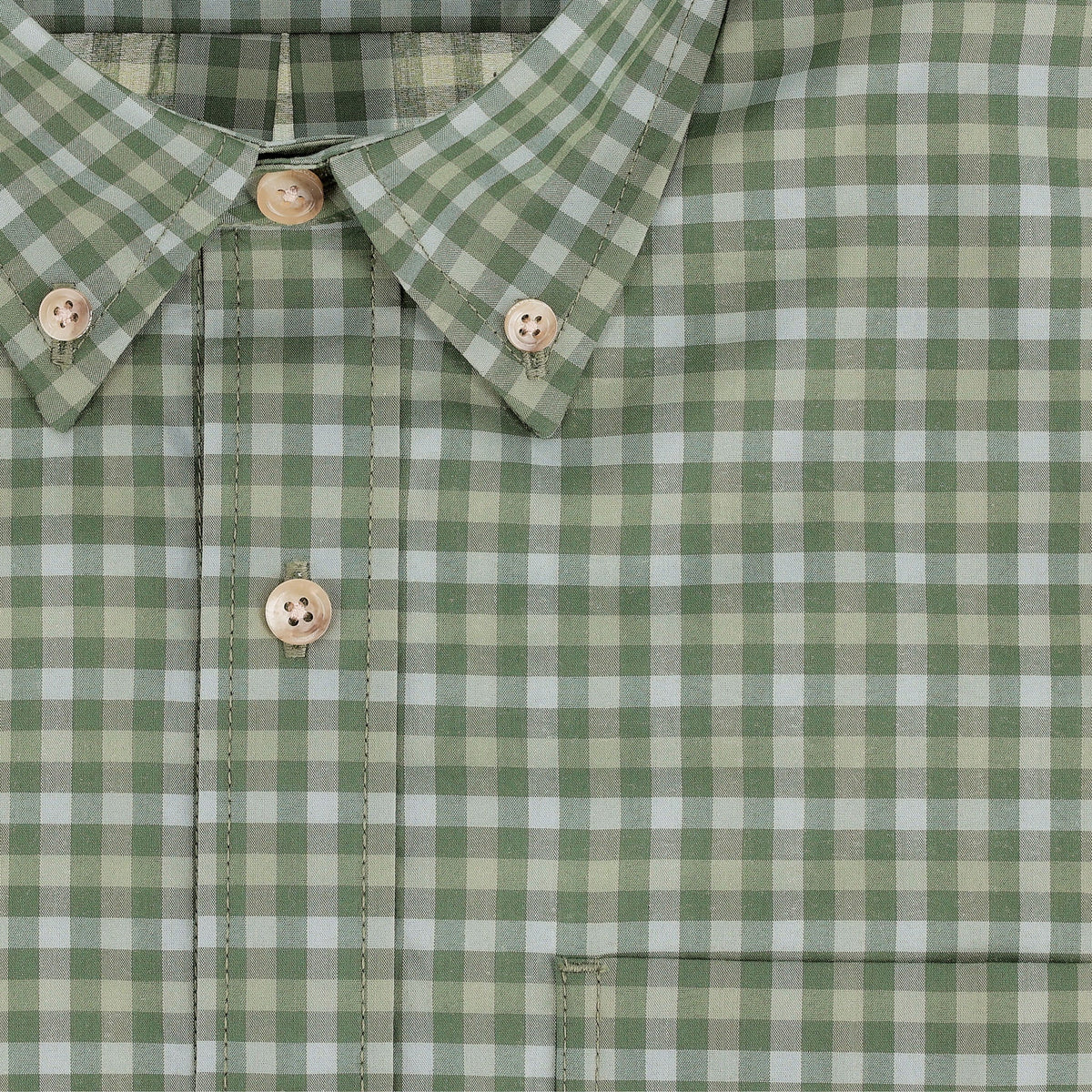 Close-up of the Tom Beckbe Powell Performance Shirt in green and white checks with beige buttons and front pocket.