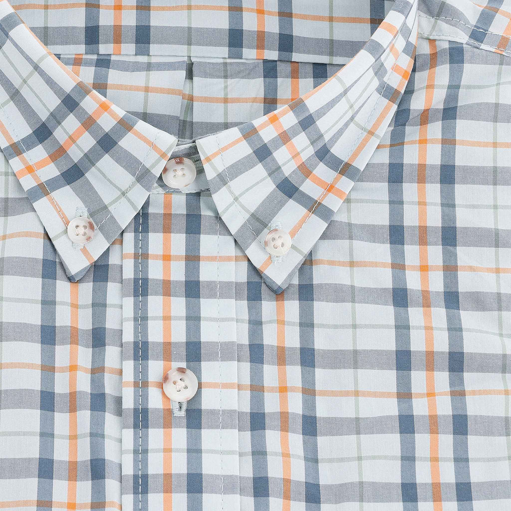 Close-up of the Tom Beckbe Powell Performance Shirt, short sleeve with blue, orange, and white plaid and white buttons.