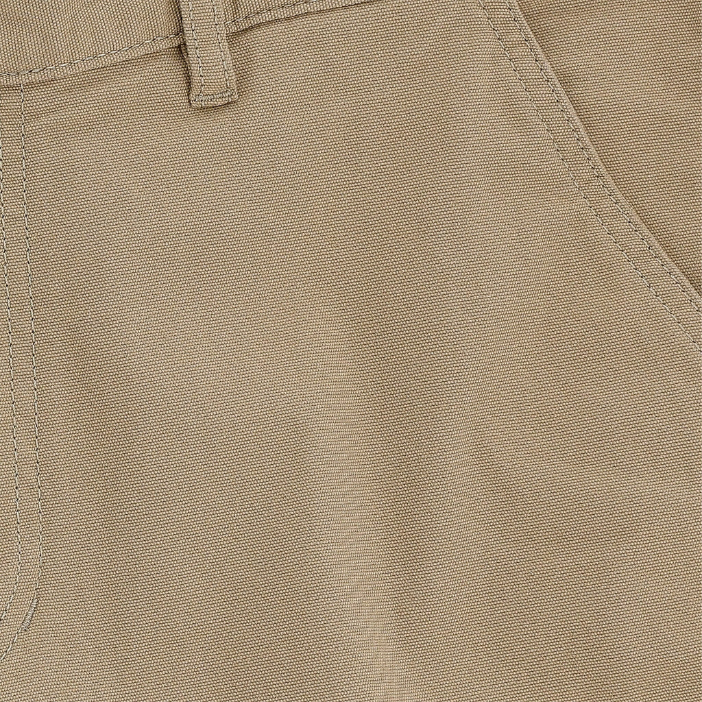 Close-up of Tom Beckbes Reid Short in khaki, highlighting the belt loop, front pocket seam detail, and brass zip fly.