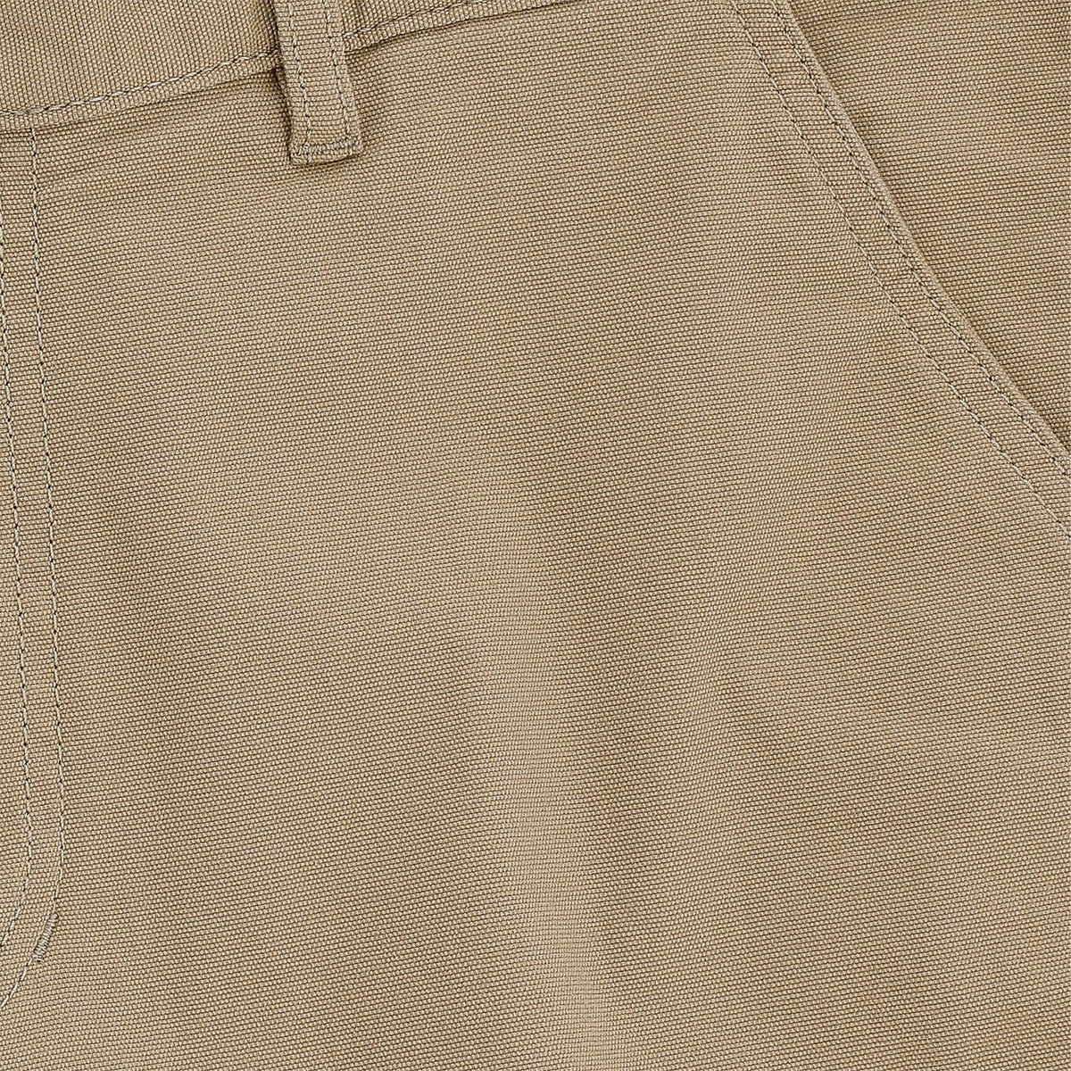 Close-up of Tom Beckbes Reid Short in khaki, highlighting the belt loop, front pocket seam detail, and brass zip fly.