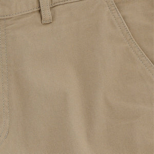 Close-up of Tom Beckbes Reid Short in khaki, highlighting the belt loop, front pocket seam detail, and brass zip fly.