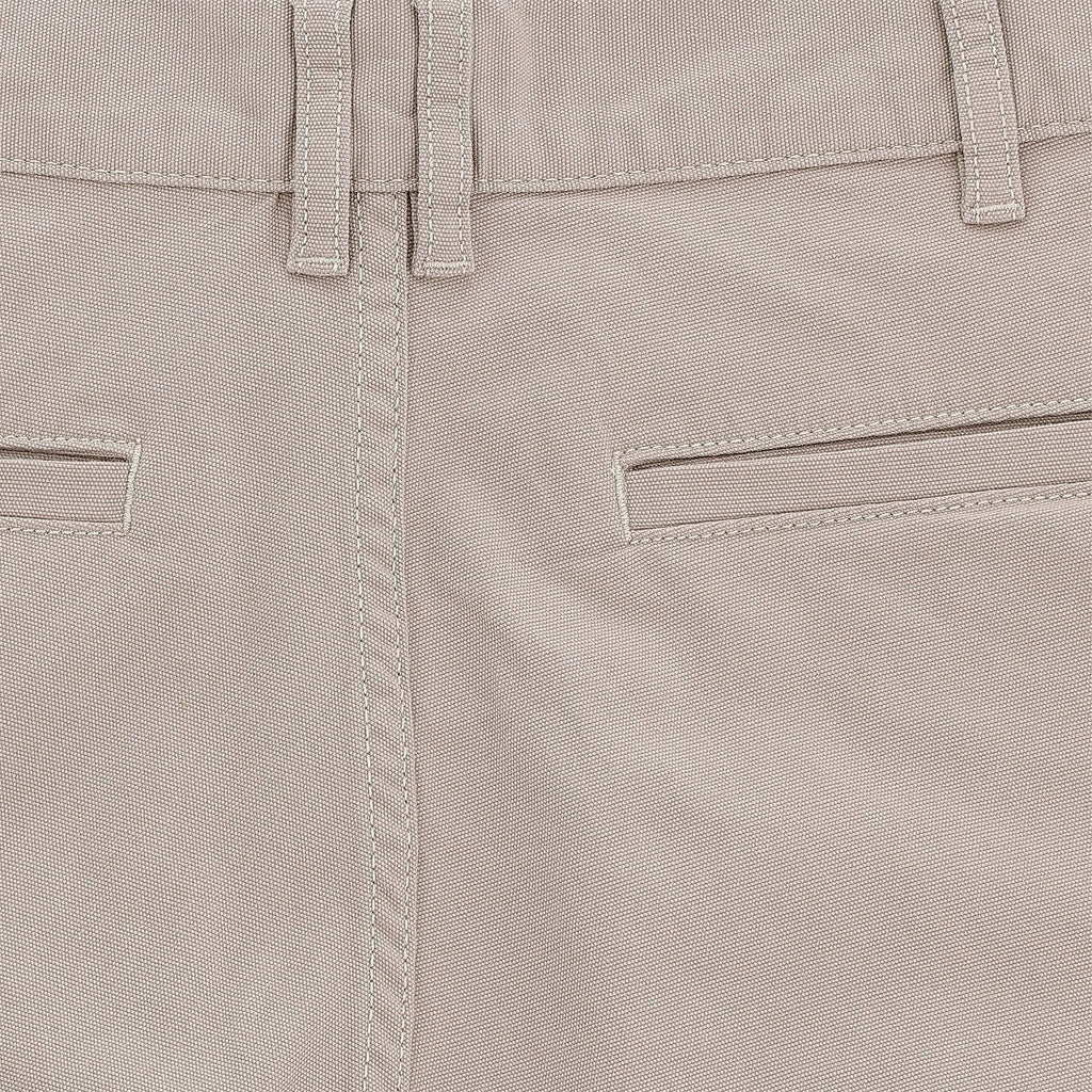 Close-up of Tom Beckbes Reid Short in beige, featuring mid-rise, double belt loops, horizontal pockets, detailed stitching.