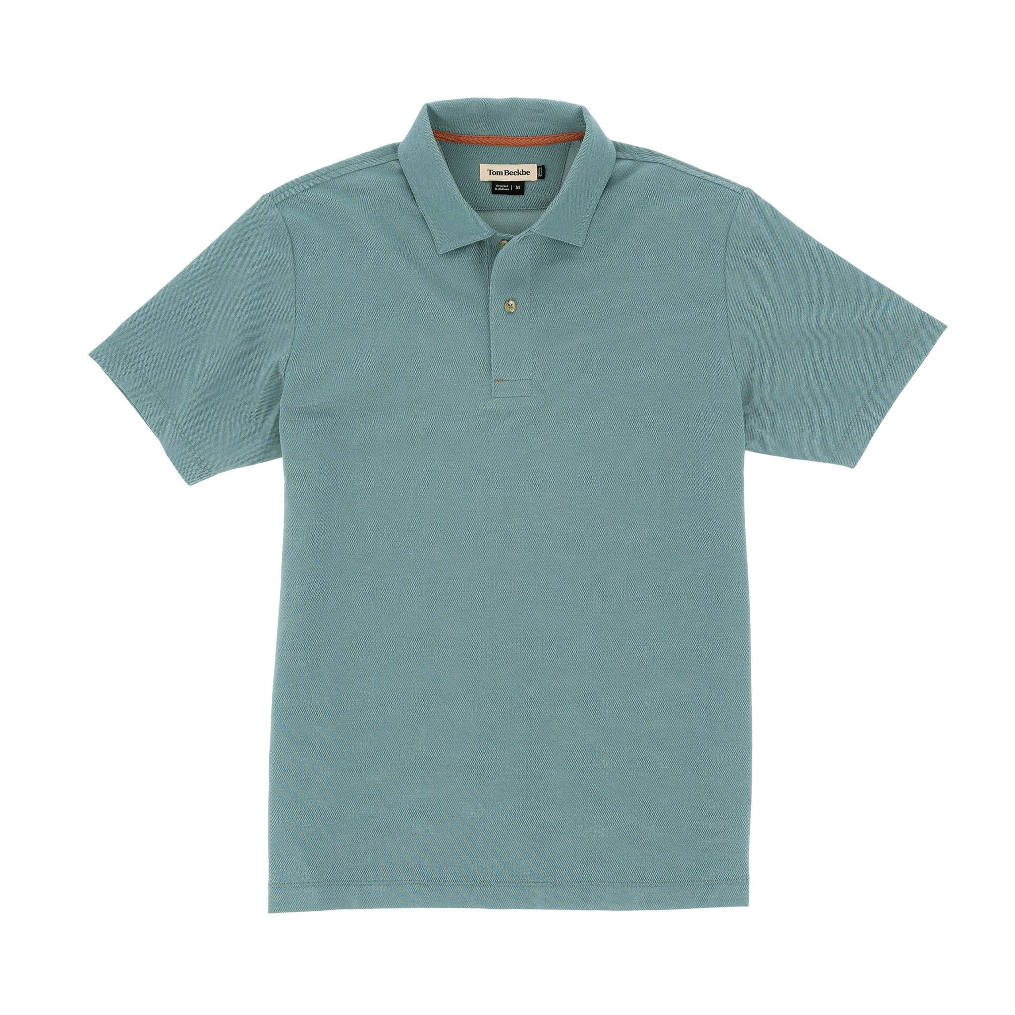 Tom Beckbes Coastal Polo Shirt, light blue, moisture-wicking, with collar and short sleeves, laid flat on a white background.