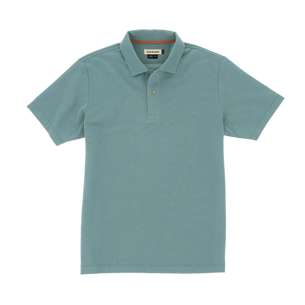 Tom Beckbes Coastal Polo Shirt, light blue, moisture-wicking, with collar and short sleeves, laid flat on a white background.