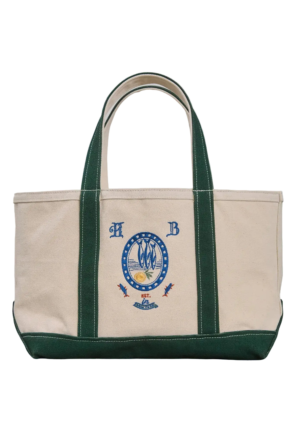 The medium canvas tote bag with green handles and fish motifs