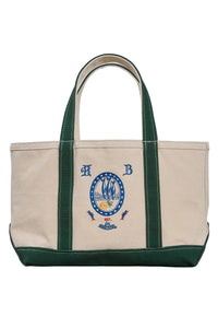 The medium canvas tote bag with green handles and fish motifs
