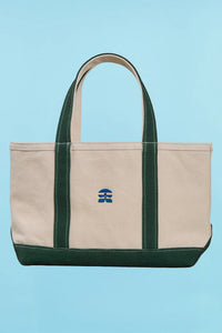 The medium canvas tote bag with green handles and fish motifs