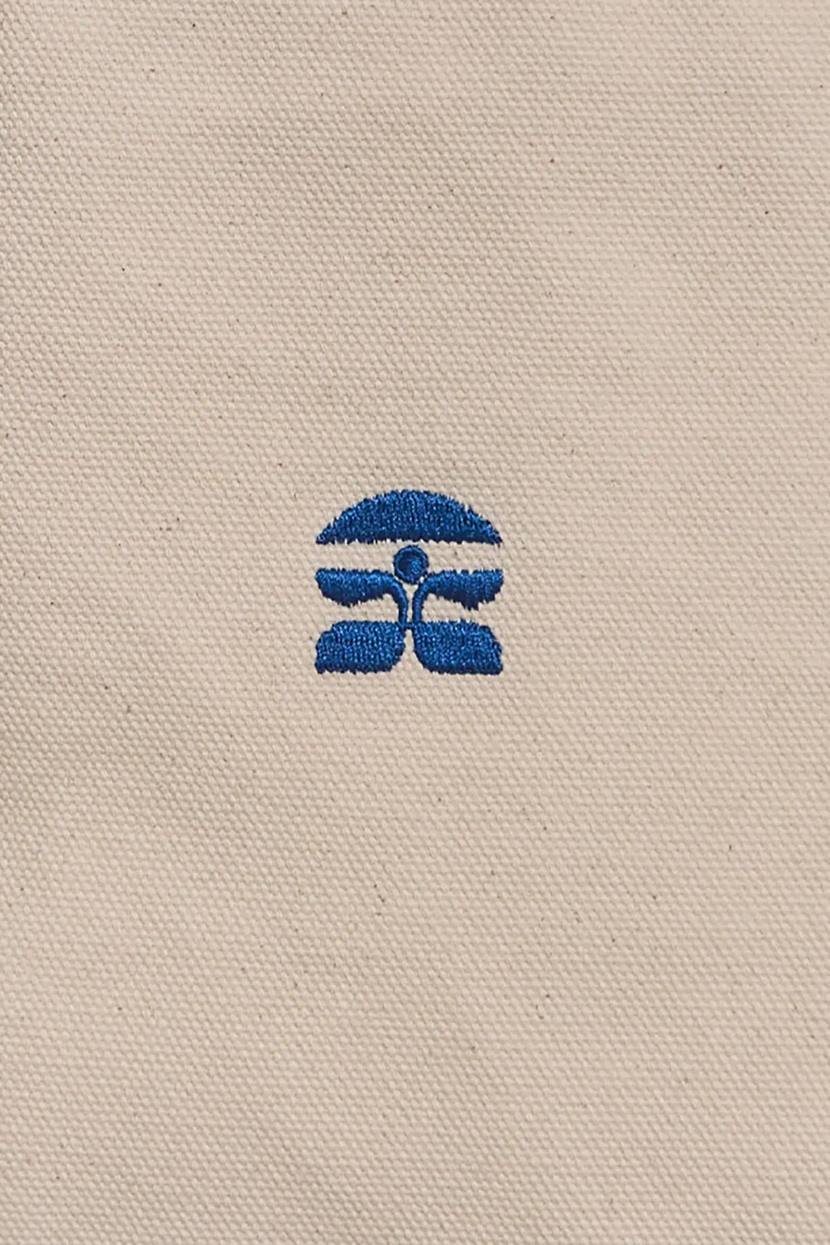 The medium canvas tote bag with green handles and fish motifs