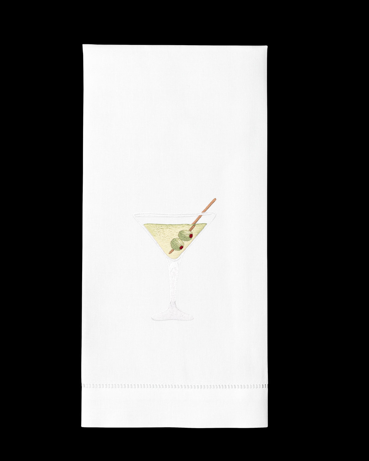 A white hand towel with a hemstitch. A dirty martini is embroidered in the center.