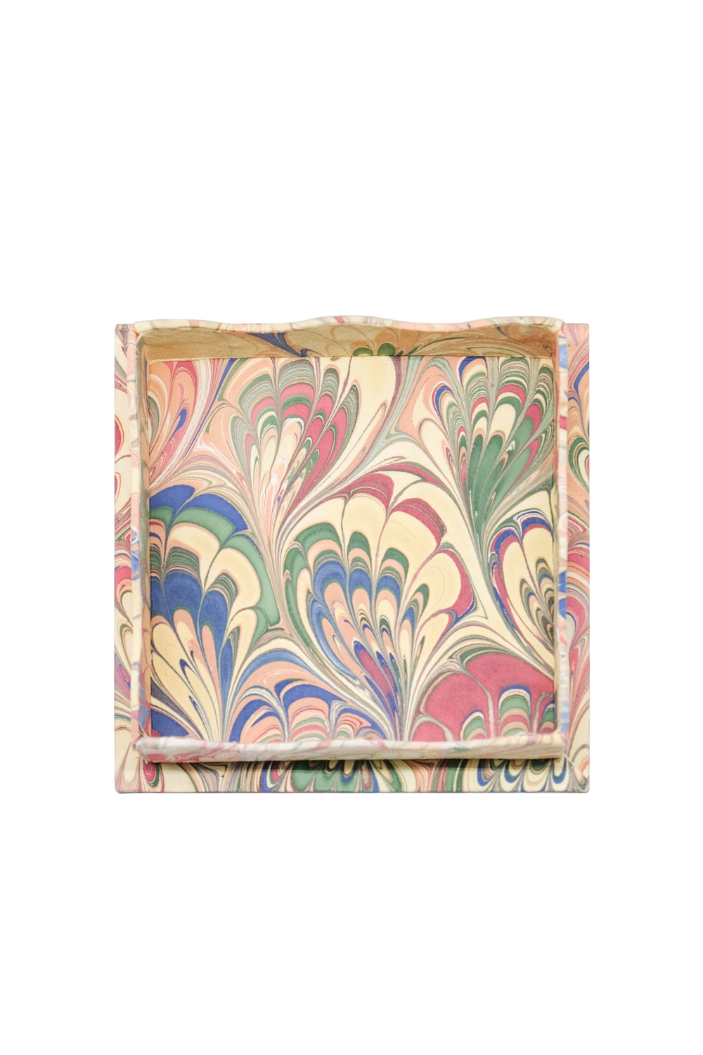 Top view of Trinket cocktail napkin tray set showcasing hand-marbled multicolor pattern and scalloped edges on white background