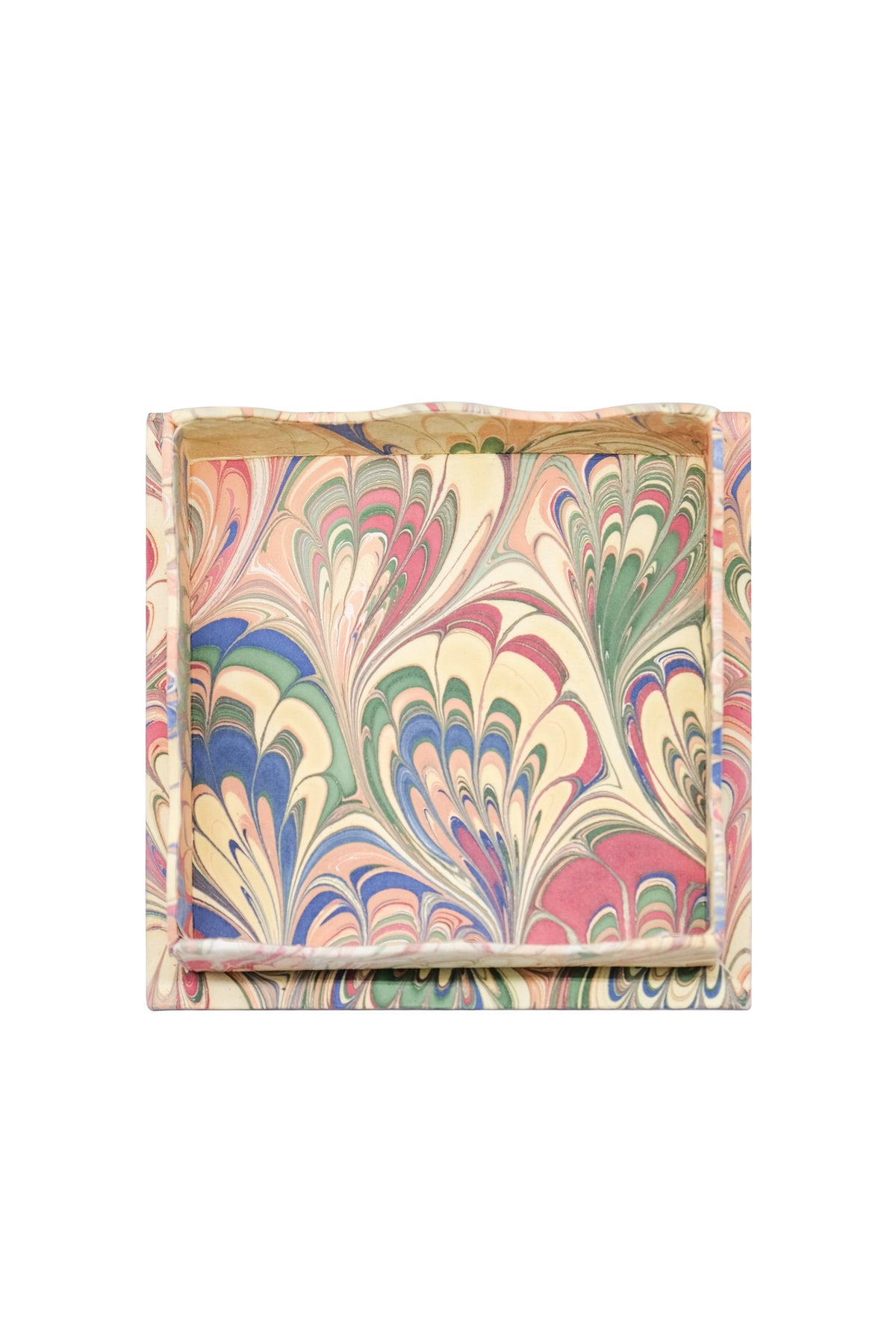 Top view of Trinket cocktail napkin tray set showcasing hand-marbled multicolor pattern and scalloped edges on white background