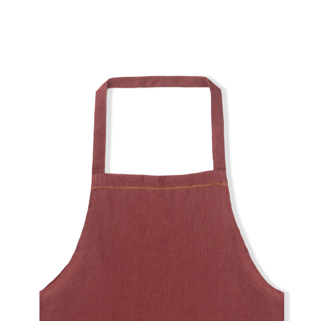 detail of marsala linen apron with ochre hemstitch 