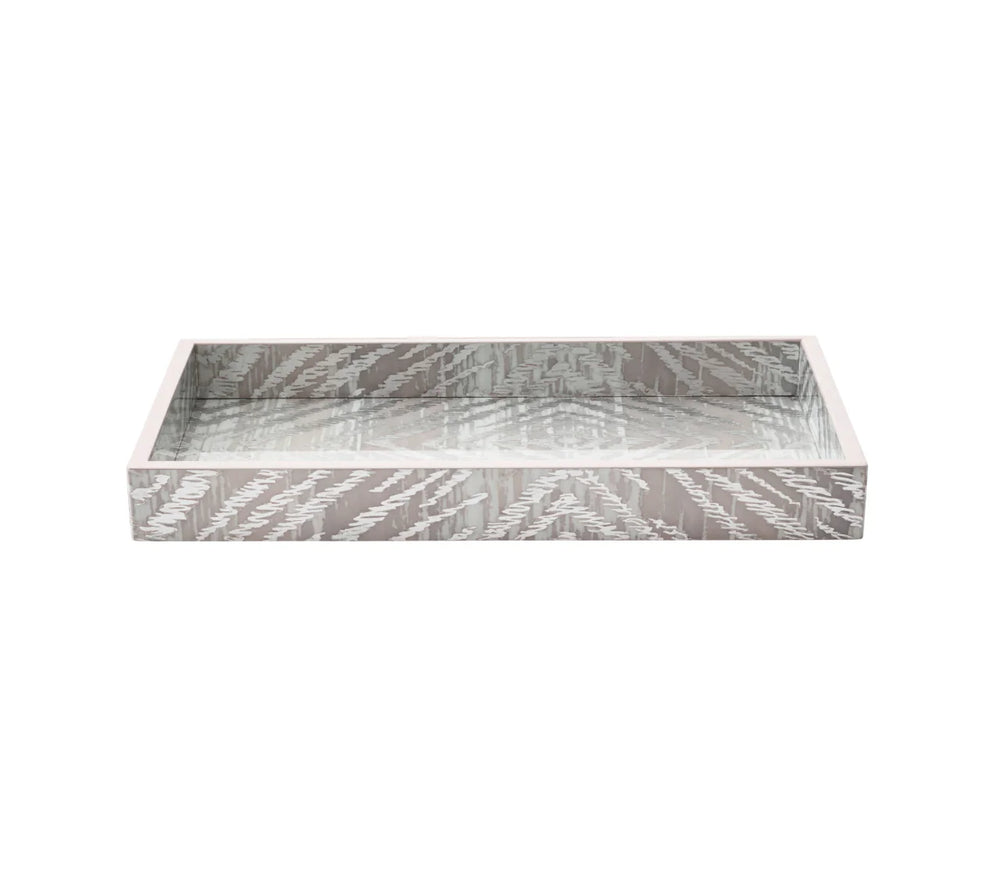 Three-quarter view of Zebra Tray showcasing metallic silver and gray zebra pattern and raised sides with white background