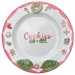 Front view of Christmas cookies plate showcasing hand-painted holiday motifs and Cookies lettering on a white background