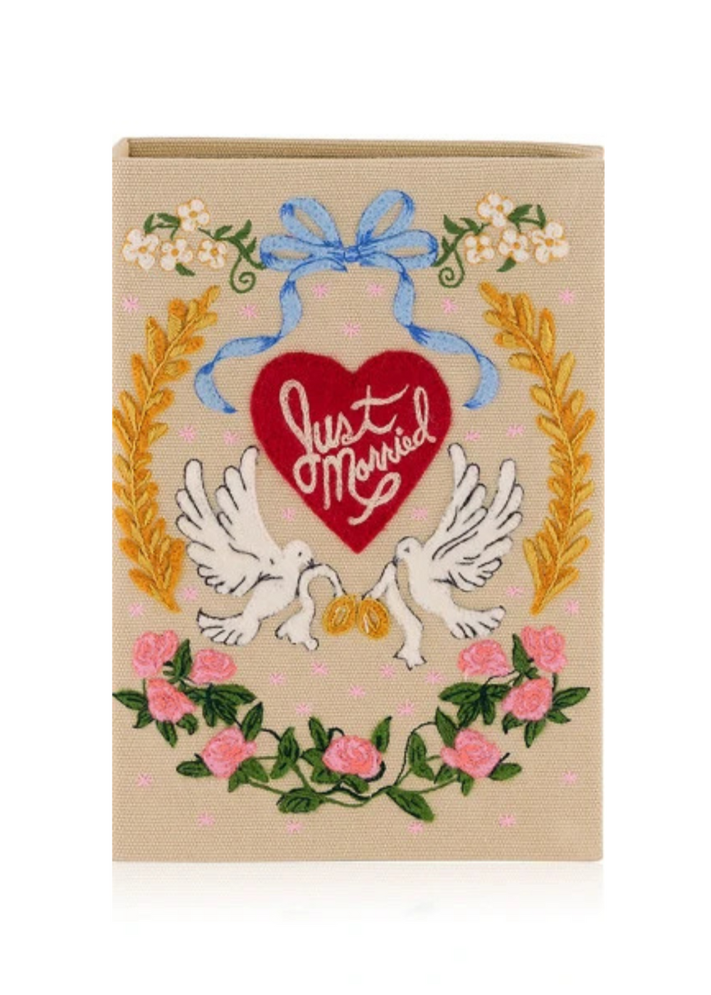 Front view of Just Married Book Clutch in Ivory showcasing hand-embroidered wedding motifs and red heart text on a white background