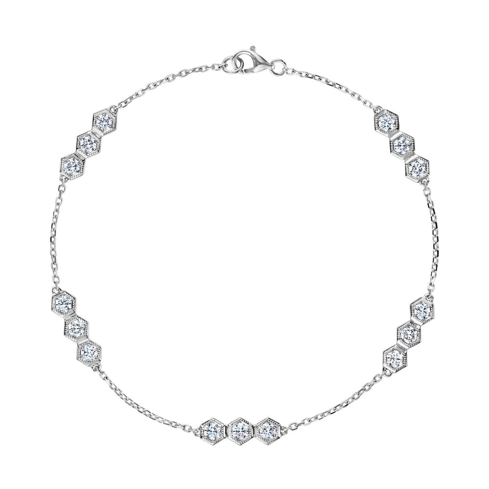 The Serpentine Station Bracelet features trios of sparkling round brilliant diamonds set in hexagonal clusters along a delicate silver chain, secured with a lobster clasp.