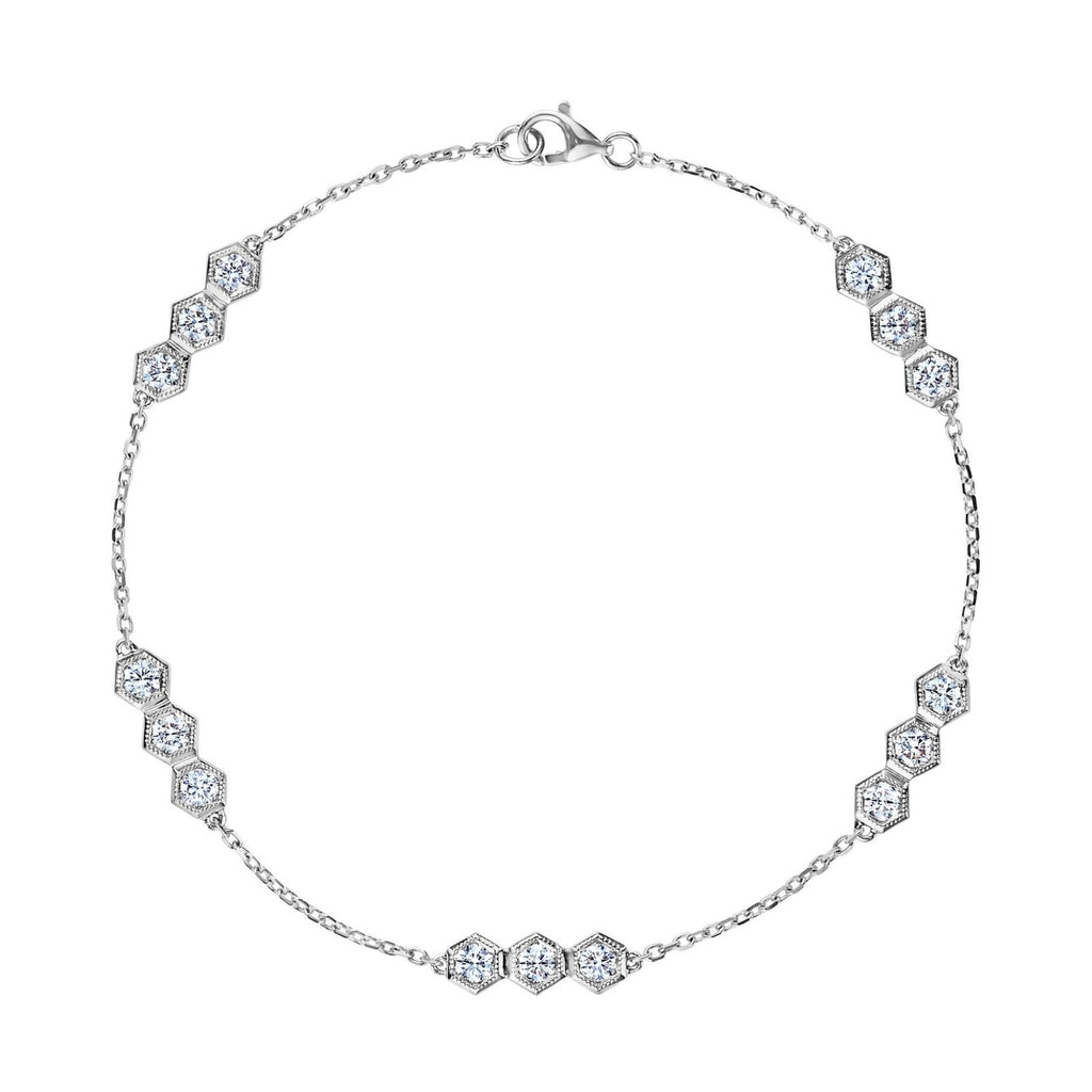 The Serpentine Station Bracelet features trios of sparkling round brilliant diamonds set in hexagonal clusters along a delicate silver chain, secured with a lobster clasp.