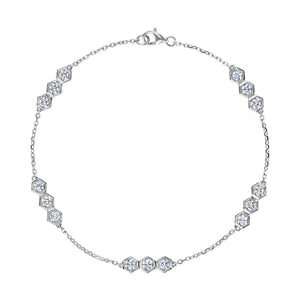 The Serpentine Station Bracelet features trios of sparkling round brilliant diamonds set in hexagonal clusters along a delicate silver chain, secured with a lobster clasp.