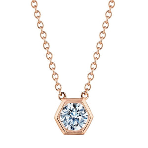 The Hexagon Bezel Set Round Brilliant Diamond Pendant showcases a round, sparkling diamond set in a rose gold hexagon bezel, hanging from a delicate rose gold chain.