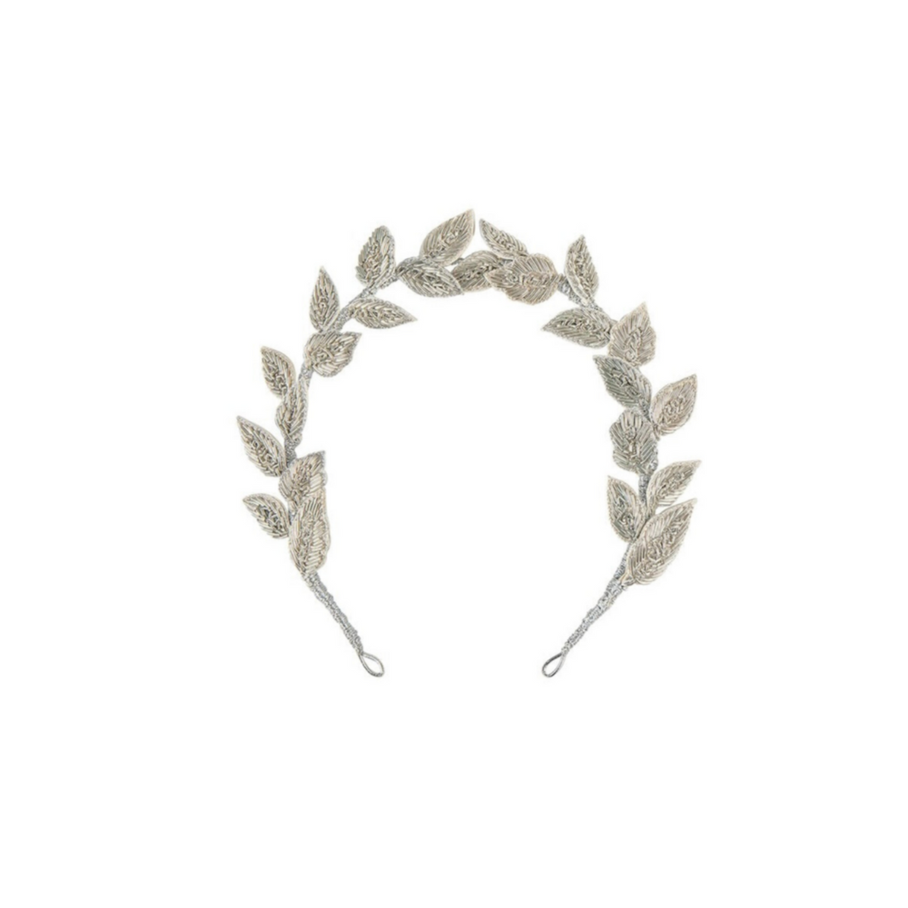 Front view of Charlotte Crown headband showing silver hand-embroidered leaves, wired flexible base, and ribbon loops on white background